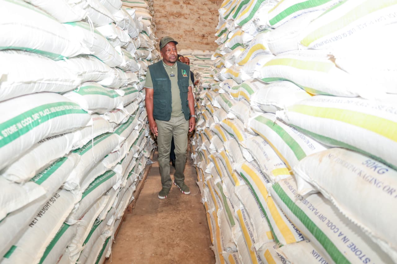 Agriculture and Livestock Development Cabinet Secretary Mutahi Kagwe in cap at a maize storage facility/HANDOUT