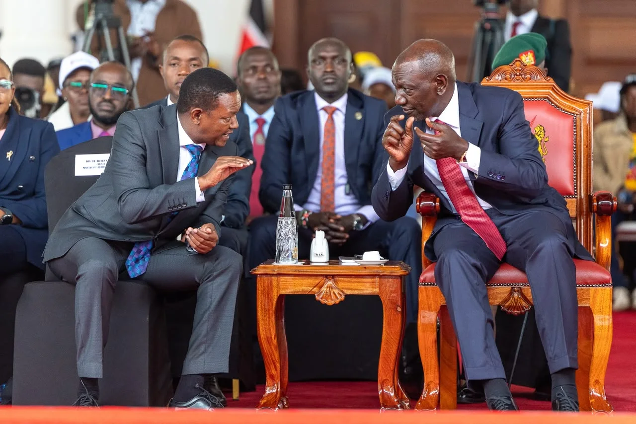 President William Ruto(R) having a chat with Labour Cabinet Secretary Alfred Mutua during NITA graduation ceremony at State House, Nairobi, on October 8, 2026.