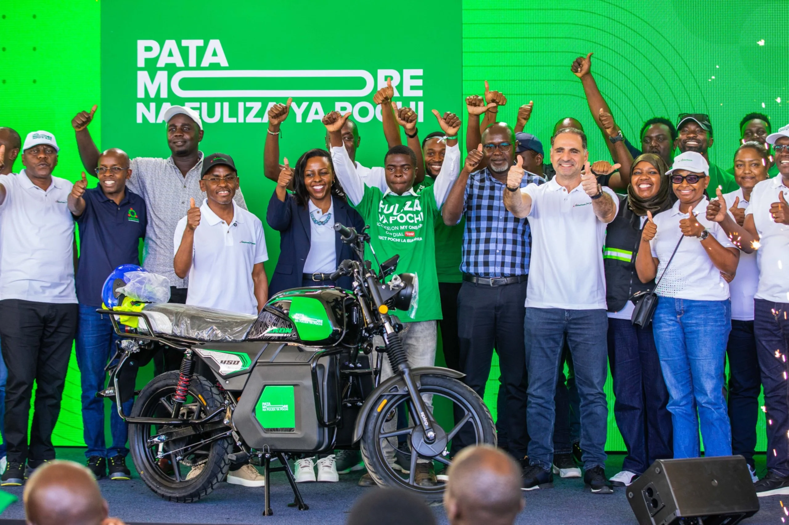 Safaricom Group CEO Peter Ndegwa with small-scale traders at Makongeni Market in Thika during the launch of Fuliza Ya Pochi on October 22, 2026.