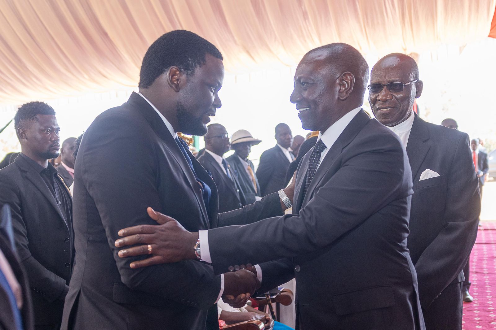 President William Ruto condoles Emmanuel Chebukati, the late IEBC chairperon's son during the funeral service in Kiminini/PHOTO Presidential Communication Service (PCS)