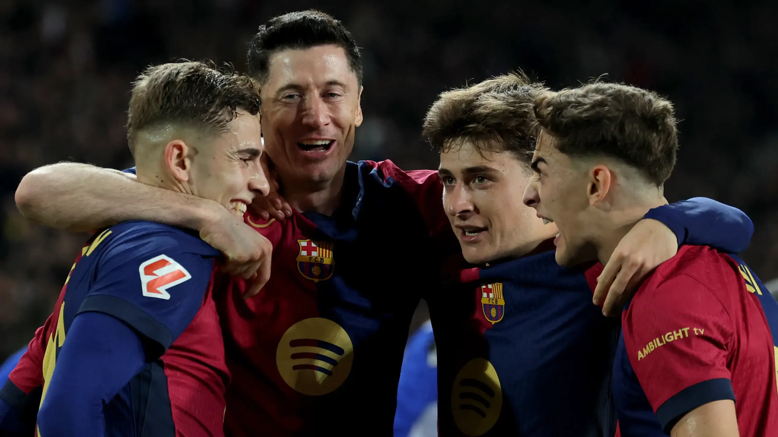 Barcelona players celebrate a goal. PHOTO/Goal.com