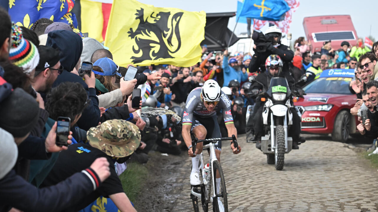 Spectator arrested for hitting French cyclist with water bottle during race