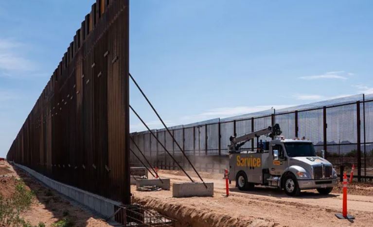 Trump’s $46m border wall expansion includes black paint strategy