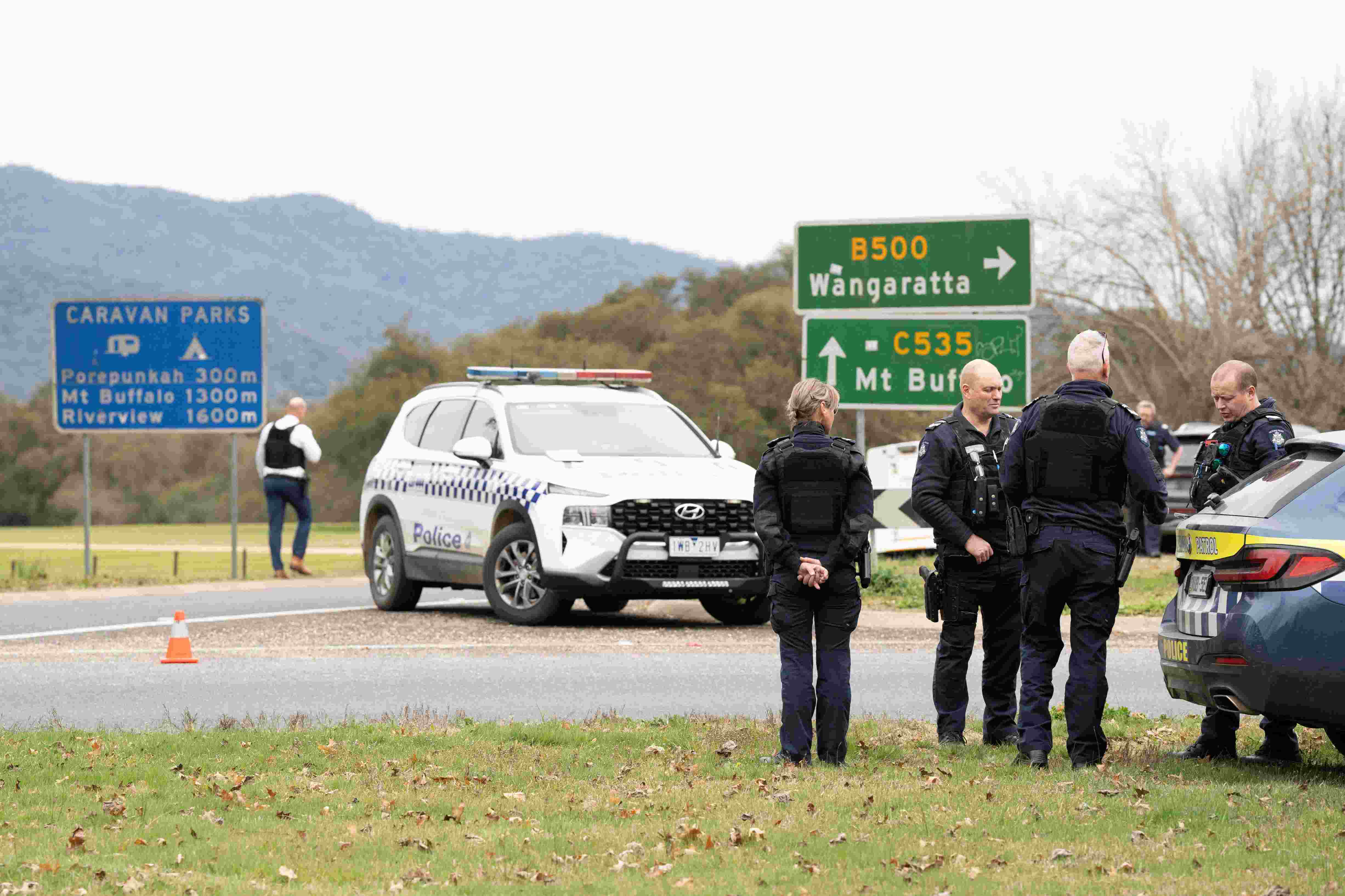 Australian town in shock as police officers killed, manhunt underway